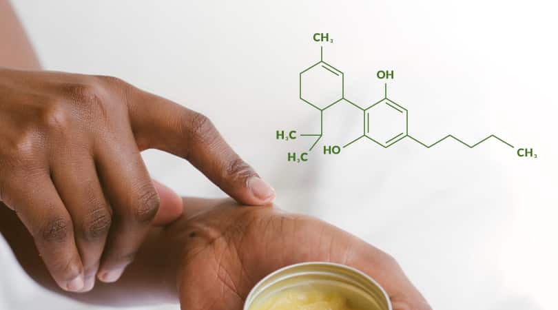 Person applying CDB topical cream to their hands