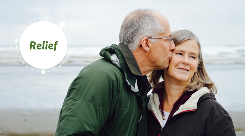 Patient relieved from Parkinson's hugging wife