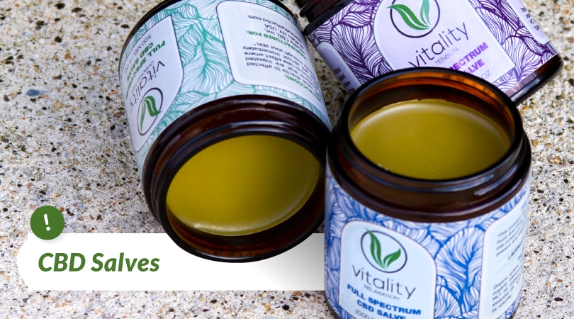 Three open containers of  Vitality's CBD salve.