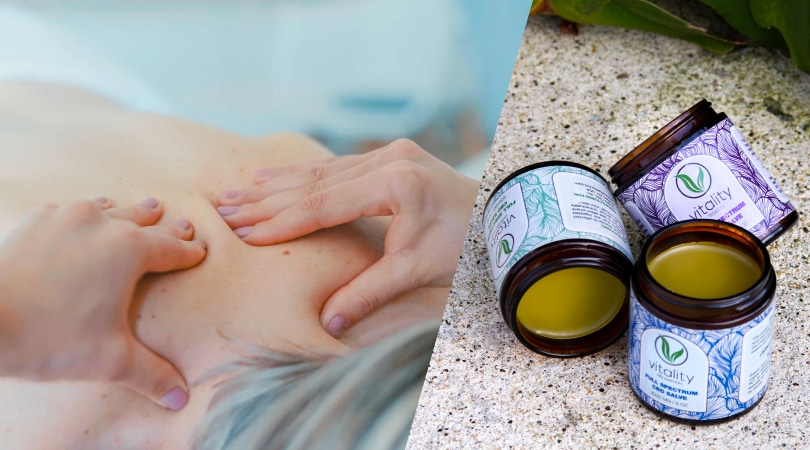 Hands applying CBD salve on a person's back to ease chronic pain.