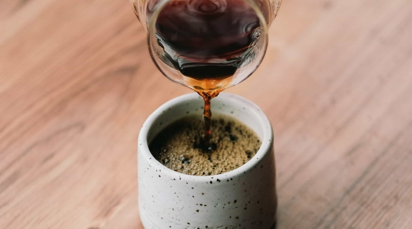 Coffee being poured into a cup.